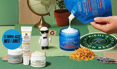 Haender, der haelder Kiehl's Ultra Facial Oil-Free Gel Cream med andre Kiehl's hudplejeprodukter, en globus, en plante og en lille figur på grøn baggrund.
