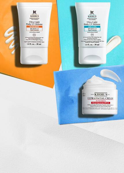 To Kiehl's solcremer sammen med en krukke Ultra Facial Cream med SPF på klare baggrunde, der fremhaever UV-beskyttende egenskaber.