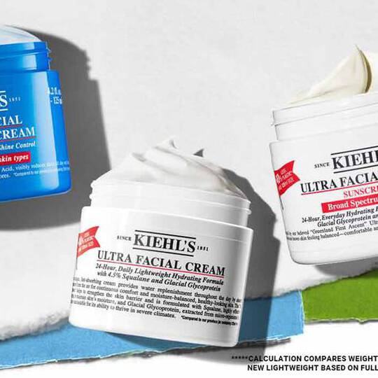 Tre hudplejeprodukter fra Kiehl's: Ultra Facial Oil-Free Gel Cream i blå og to Ultra Facial Creams med solcreme, alle med etiketter.