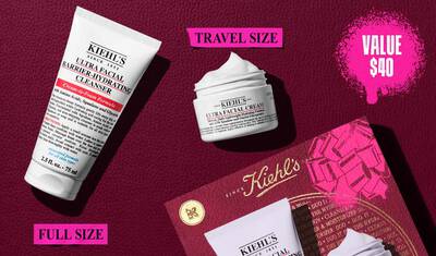 En grafik, der viser en hvid "KIEHL'S ULTRA FACIAL BARRIER-HYDRATING CLEANSER" tube maerket "FULL SIZE" og en mindre hvid "KIEHL'S ULTRA FACIAL CREAM" krukke maerket "TRAVEL SIZE". Øverst til højre er der en pink, sprøjtet tekstboks, hvor der står "VALUE $40". En delvis Kiehl's gaveaeske med en pink grafisk sløjfe er synlig i nederste højre hjørne.
