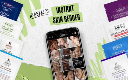 Billede af en smartphone med en app, der viser forskellige ansigtstraek, samt en QR-kode til scanning for at komme i gang.