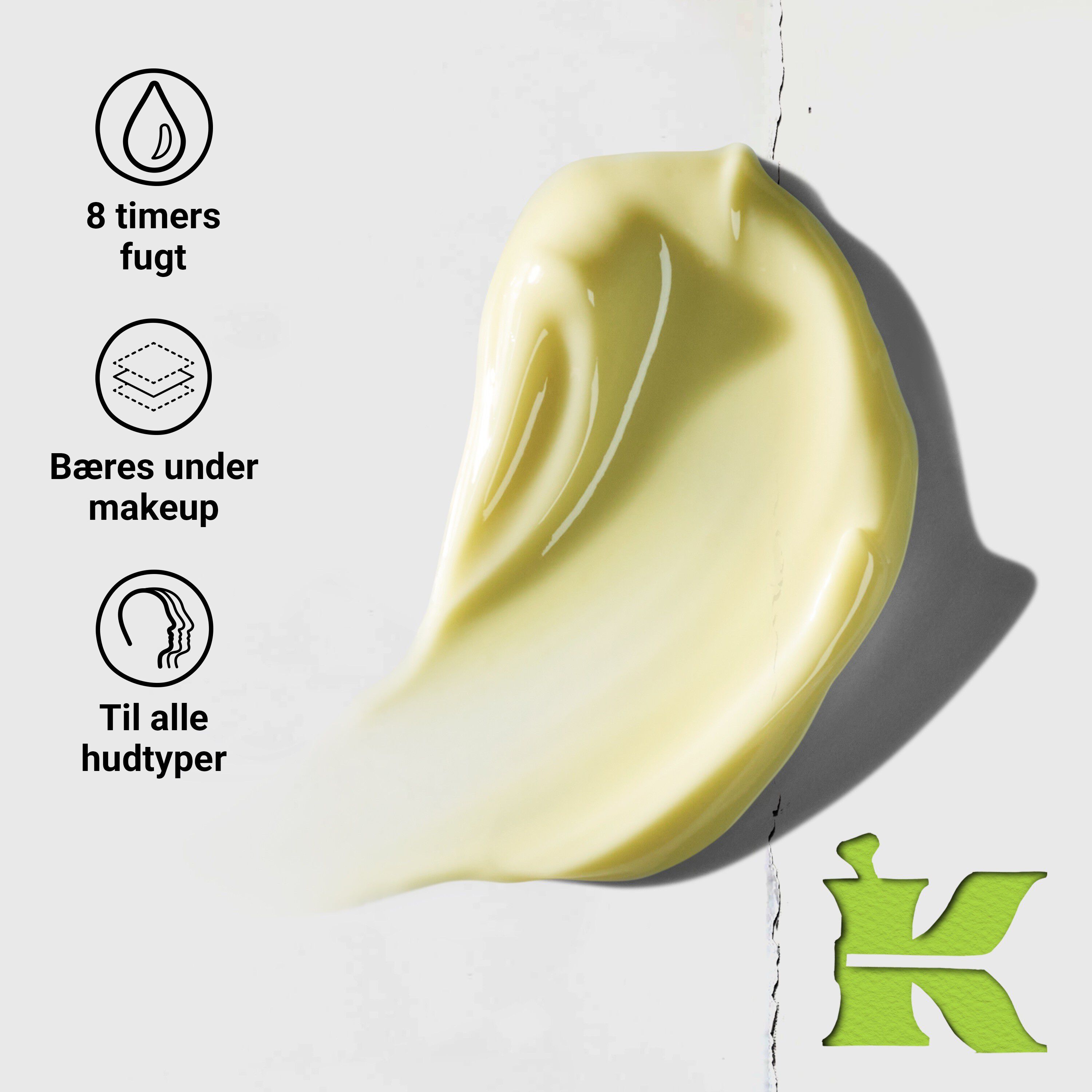 Blinkende model med en krukke Kiehl's Creamy Eye Treatment with Avocado, der daekker det ene øje