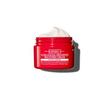 Rød krukke med Kiehl’s Ultra Facial Meltdown Recovery Cream Whip, der viser en pisket creme-konsistens.